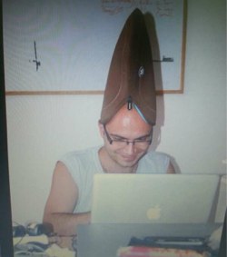 bobim6 laptop cover on his head