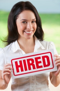 iStock photo woman with a Hired sign