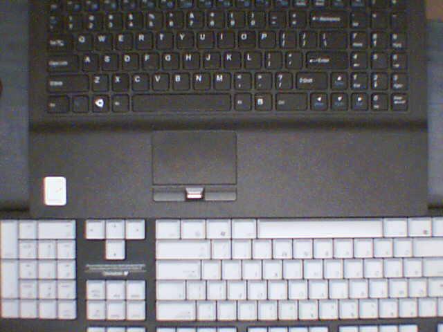 A comparison of the laptop's keyboard and a standard size keyboard