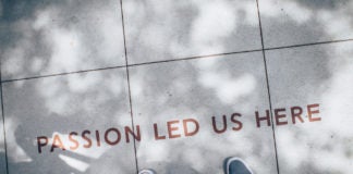 Feet on sidewalk, with words "passion led us here"